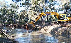 Excavator placing logs in Broken Creek