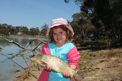 A junior angler catching a fish