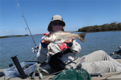 Fisherman holding fish