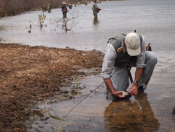 An angler baits his hook at Devilbend Reservoir