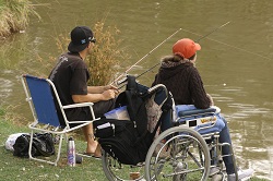 A junior angler catching a fish